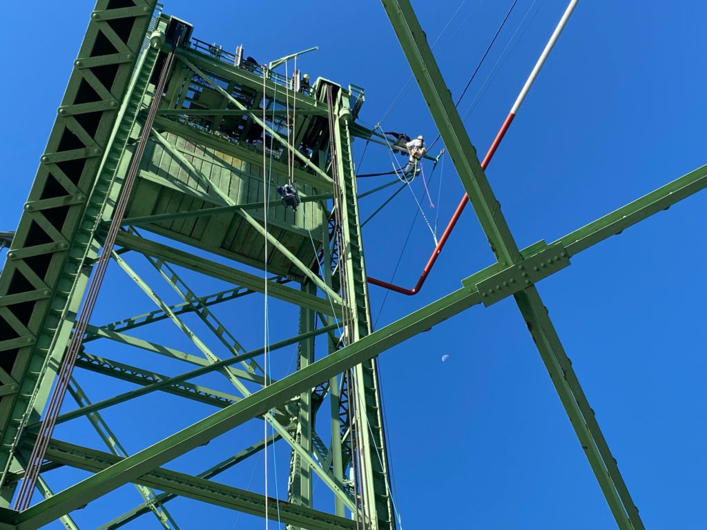 Assembly being hoisted off the south lift tower